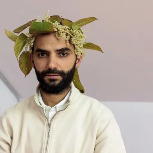 Image: Self portrait with Japanese knotweed crown, Ghent 2022. Courtesy of the artist